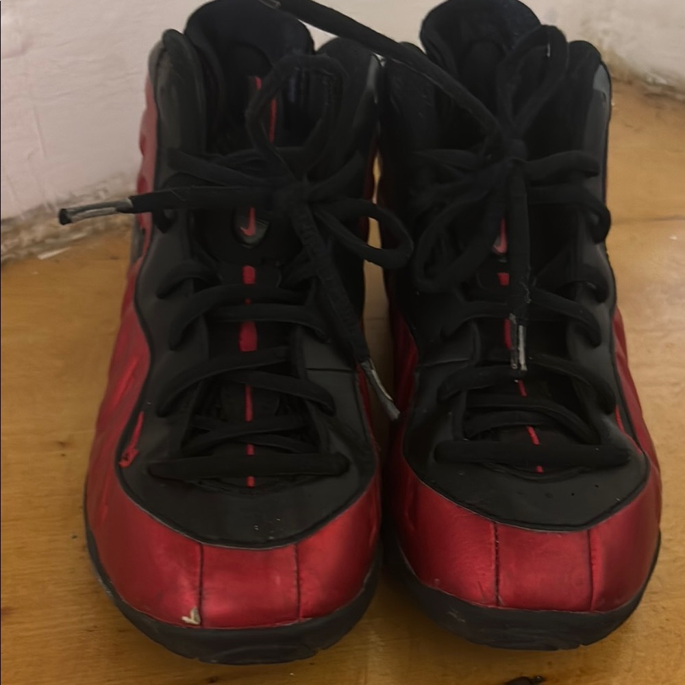 Nike Black and Red High-Top Sneakers with Foamposite Design